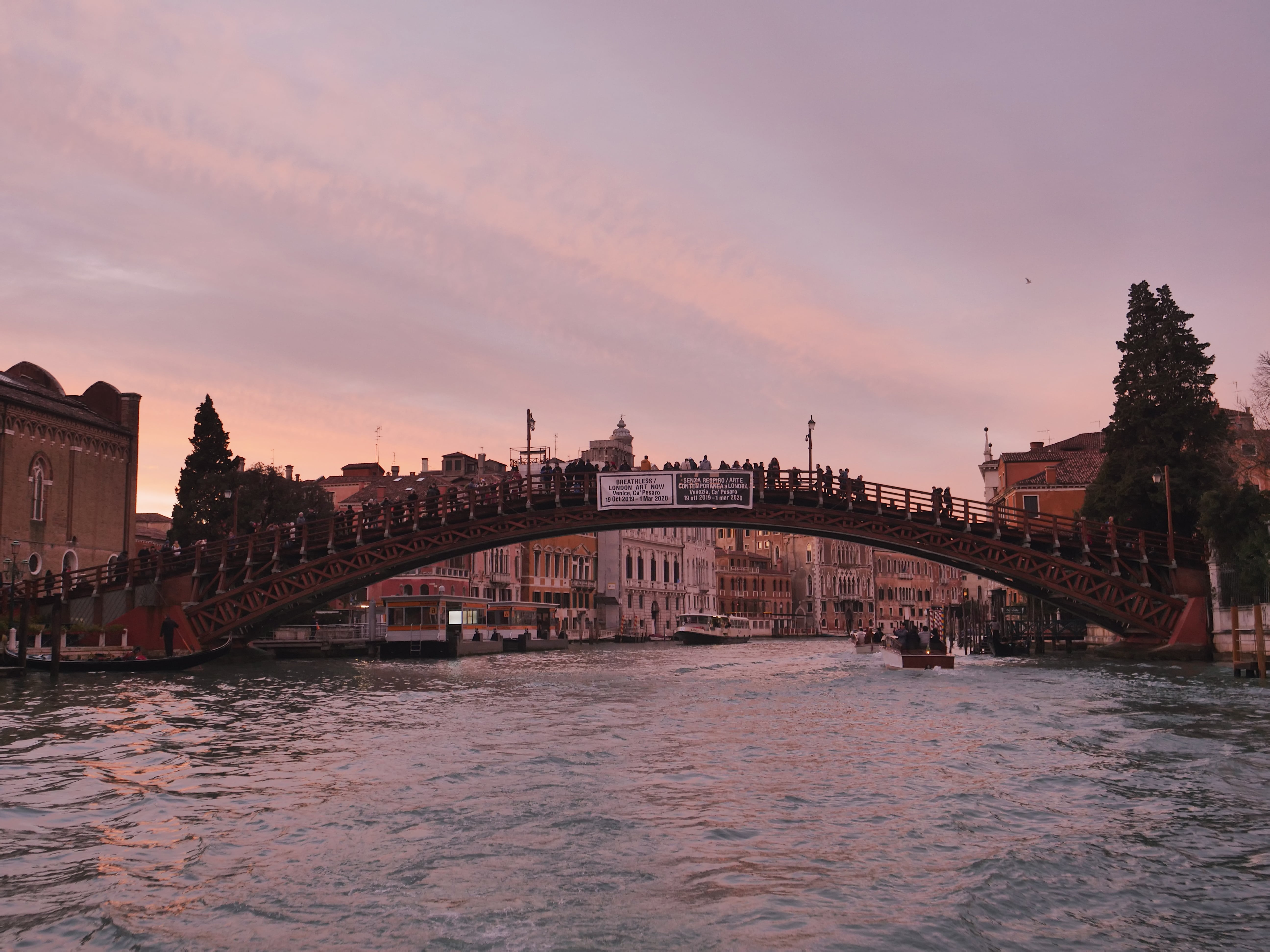 bridge over a canal during sunset